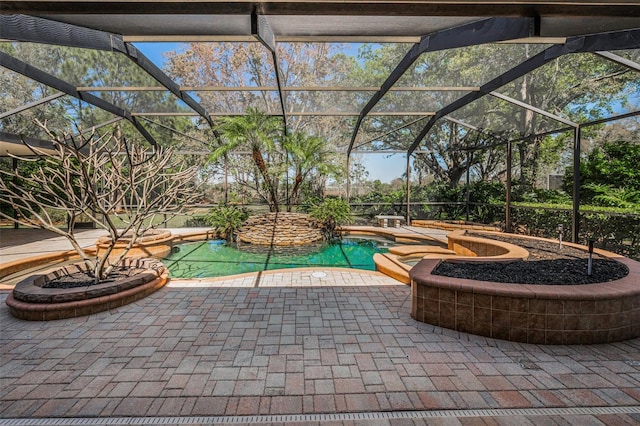 pool featuring a jacuzzi, a patio, and a lanai