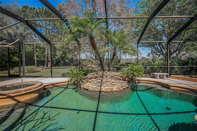 pool featuring a lanai and a patio area