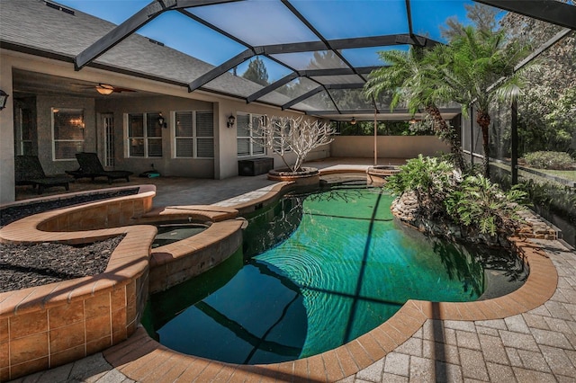 view of pool with a patio, a pool with connected hot tub, and a lanai