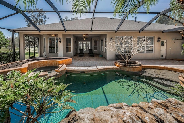 pool with ceiling fan, an in ground hot tub, a lanai, and a patio