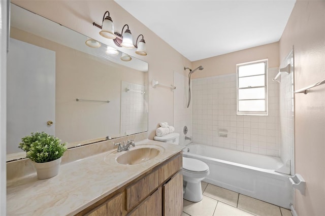 bathroom with tile patterned flooring, bathing tub / shower combination, toilet, and vanity