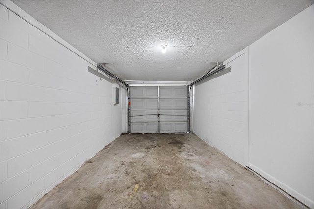 garage with concrete block wall