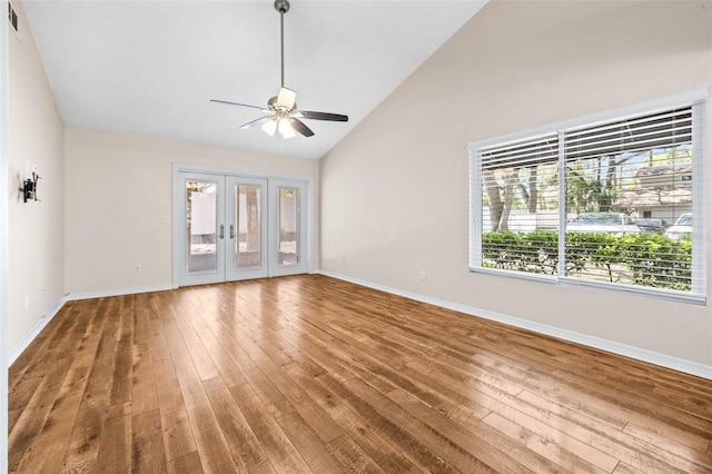 unfurnished living room with hardwood / wood-style flooring, french doors, baseboards, and ceiling fan