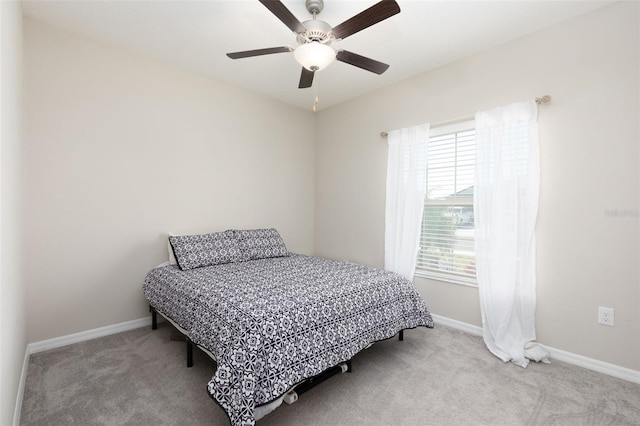 bedroom featuring carpet flooring, a ceiling fan, and baseboards