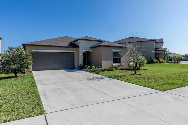 view of front of house with a front yard, roof with shingles, stucco siding, driveway, and an attached garage