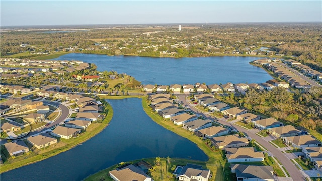 birds eye view of property with a residential view and a water view