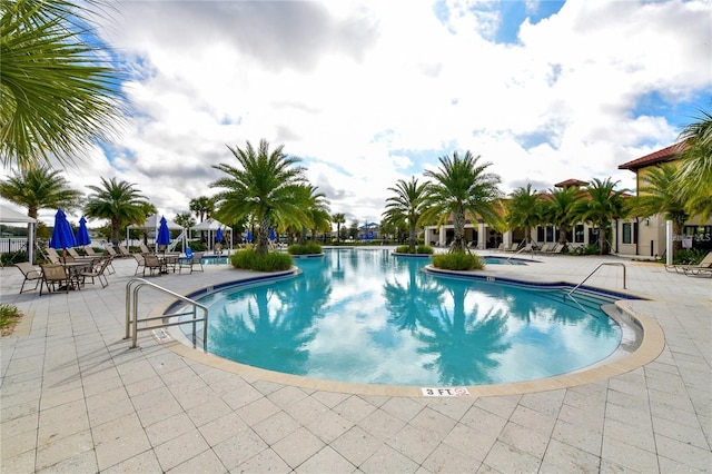 pool featuring a patio area