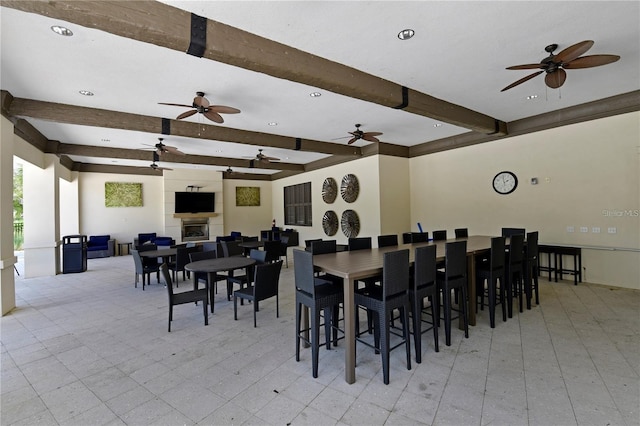 dining area with recessed lighting, beamed ceiling, light floors, and a ceiling fan