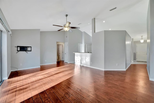 unfurnished living room featuring visible vents, baseboards, a ceiling fan, and wood finished floors