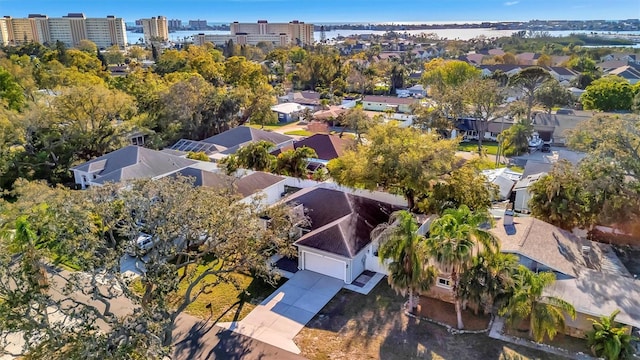 drone / aerial view featuring a city view and a residential view