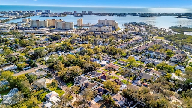 birds eye view of property featuring a water view and a view of city