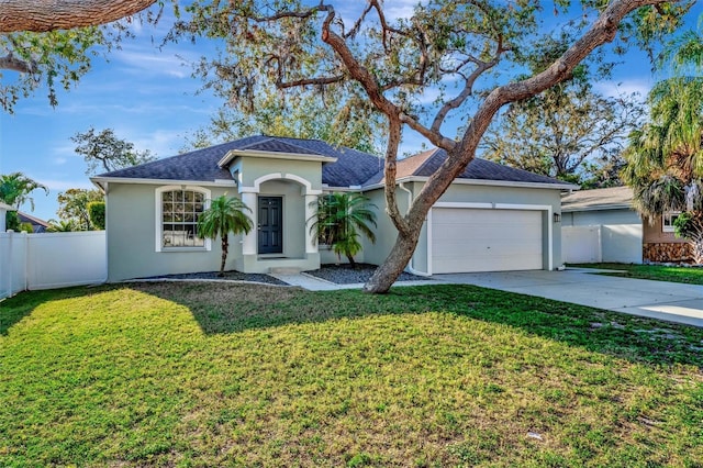 ranch-style house with stucco siding, driveway, a front lawn, and fence