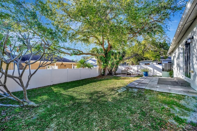 view of yard featuring a patio area and a fenced backyard