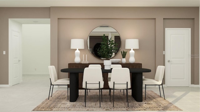 dining space featuring light tile patterned flooring and baseboards