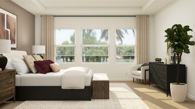 bedroom featuring baseboards and light colored carpet