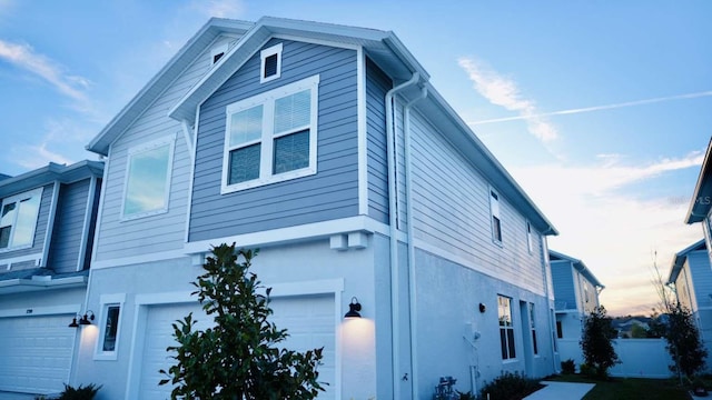 view of side of home with a garage