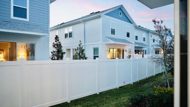 view of side of property featuring fence private yard