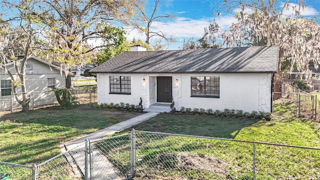 view of front of property featuring a front lawn, a fenced front yard, roof with shingles, stucco siding, and a gate