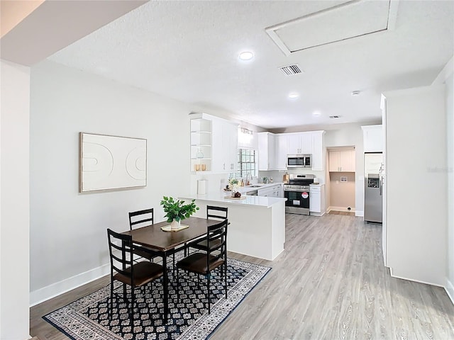 dining space with visible vents, recessed lighting, baseboards, and light wood-style floors