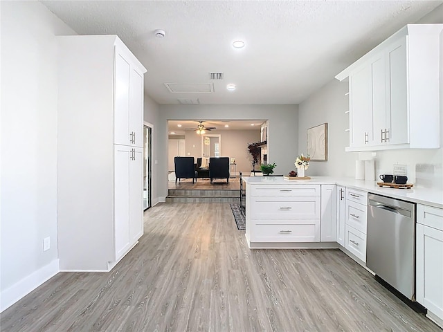 kitchen with open shelves, visible vents, stainless steel dishwasher, and light wood finished floors