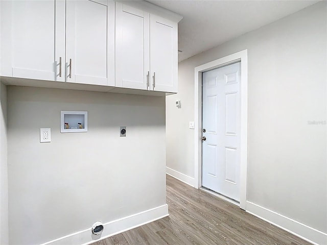 laundry area featuring washer hookup, wood finished floors, cabinet space, baseboards, and hookup for an electric dryer