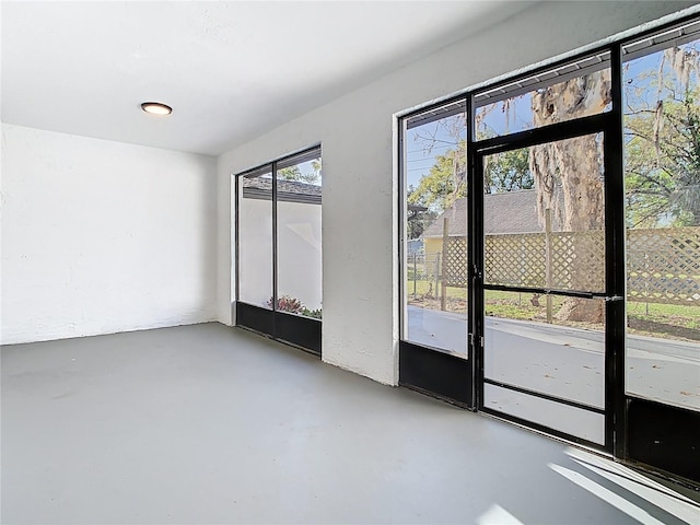 empty room featuring finished concrete floors