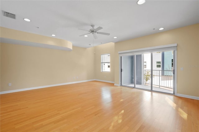 spare room featuring visible vents, baseboards, recessed lighting, light wood-style flooring, and a ceiling fan