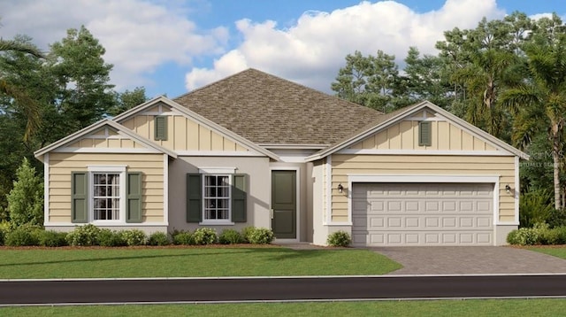 view of front of house with board and batten siding, a front lawn, driveway, and a garage