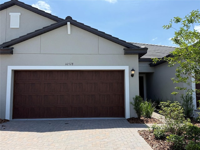 10578 Gable Dig Loop, San Antonio, FL 33576 - garage featuring driveway