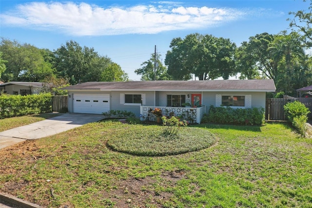 1005 Catalpa Ln, Orlando, FL 32806 - ranch-style home featuring a garage, fence, concrete driveway, brick siding, and a front lawn