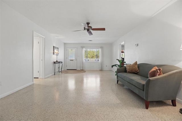1005 Catalpa Ln, Orlando, FL 32806 - living room featuring baseboards, speckled floor, and ceiling fan