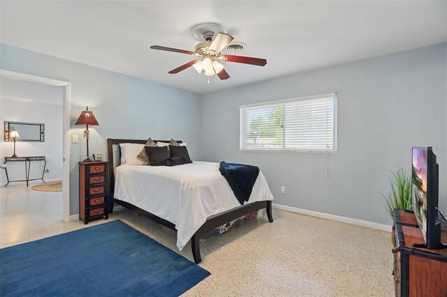1005 Catalpa Ln, Orlando, FL 32806 - bedroom with ceiling fan, speckled floor, and baseboards