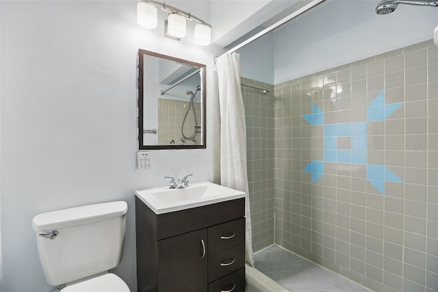 1005 Catalpa Ln, Orlando, FL 32806 - bathroom with toilet, tiled shower, and vanity