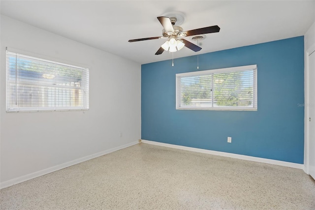 1005 Catalpa Ln, Orlando, FL 32806 - unfurnished room featuring baseboards, a ceiling fan, and speckled floor