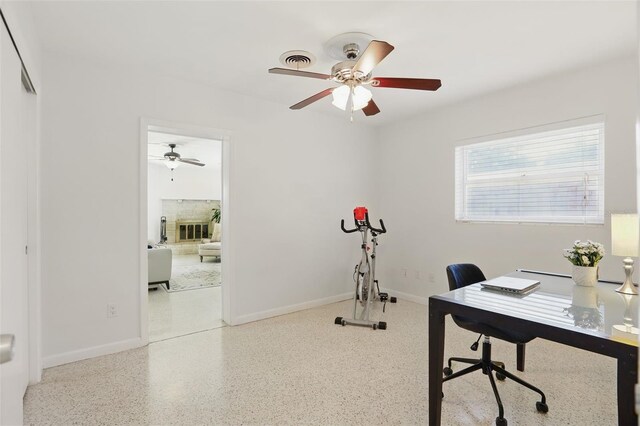 1005 Catalpa Ln, Orlando, FL 32806 - office with visible vents, baseboards, speckled floor, and a ceiling fan