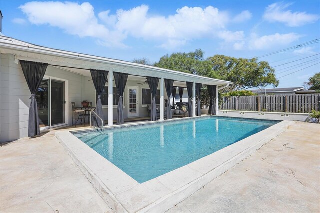 1005 Catalpa Ln, Orlando, FL 32806 - view of pool featuring a fenced in pool, a patio area, fence, and ceiling fan