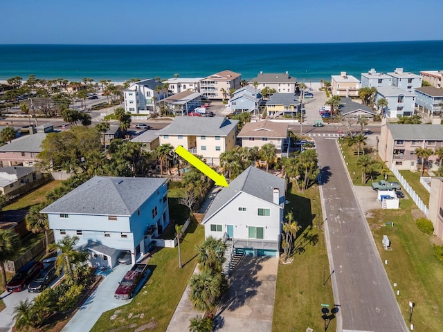 birds eye view of property with a residential view and a water view