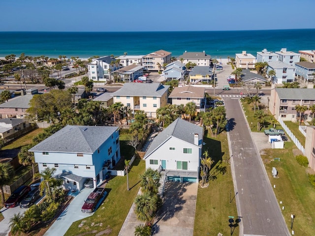 bird's eye view with a residential view and a water view