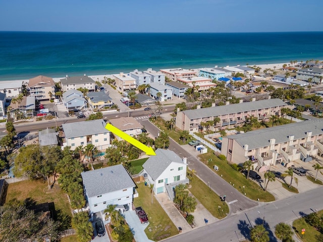 drone / aerial view featuring a residential view and a water view