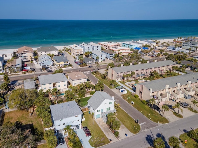 drone / aerial view with a residential view and a water view