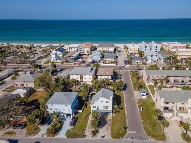 bird's eye view with a residential view and a water view