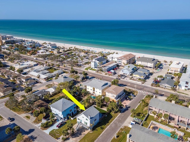 aerial view with a water view and a view of the beach