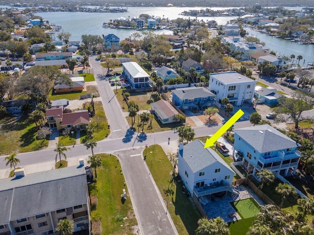 birds eye view of property with a residential view and a water view