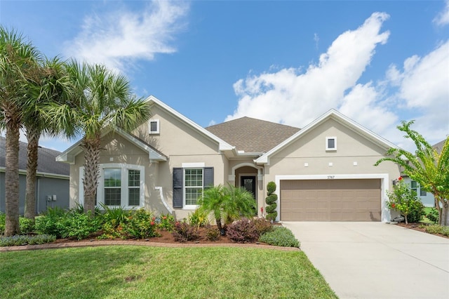 single story home featuring an attached garage, a front lawn, roof with shingles, stucco siding, and driveway