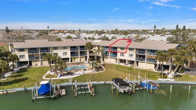 birds eye view of property with a residential view and a water view