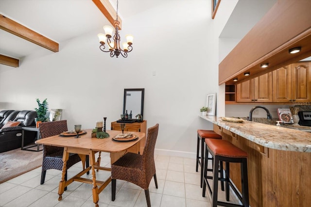 dining area featuring light tile patterned floors, beamed ceiling, an inviting chandelier, and baseboards