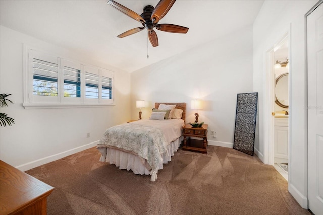 bedroom featuring a ceiling fan, carpet, baseboards, lofted ceiling, and ensuite bathroom