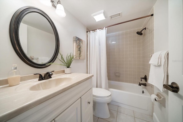 bathroom with vanity, visible vents, shower / bath combo with shower curtain, tile patterned floors, and toilet