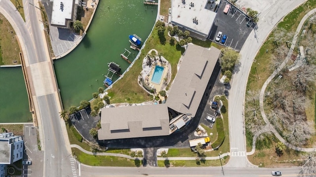 birds eye view of property with a water view