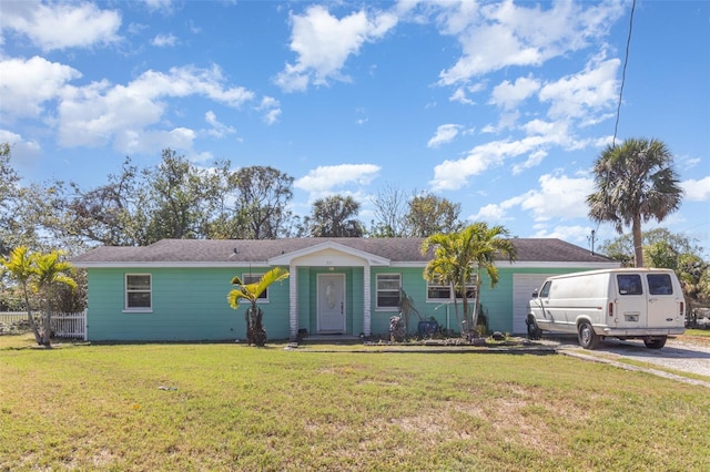 ranch-style home with a front lawn